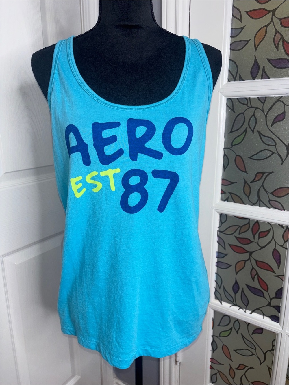 Aero Turquoise Graphic Tank Top with Bold Navy & Yellow Print